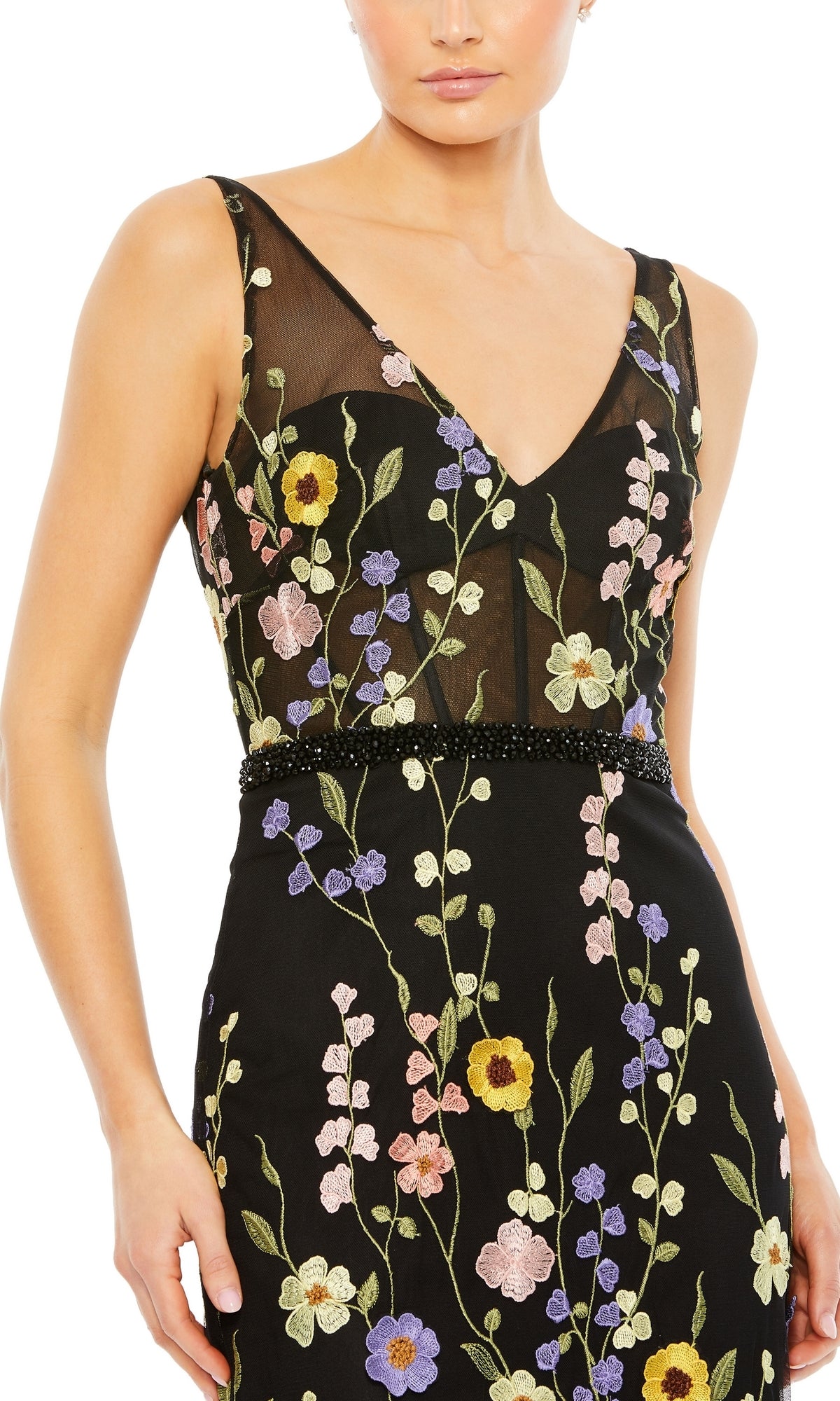 Wearing the Mac Duggal 68200 floral long black formal dress with a sleeveless sheer V-neck and colorful floral embroidery makes for the perfect evening gown.